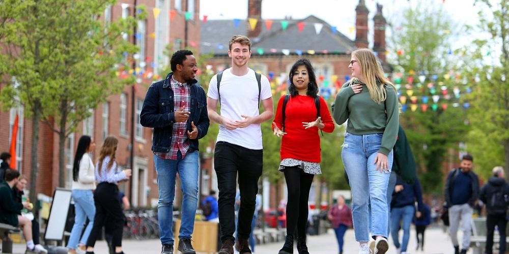 A group of international students walking outside the Leeds University Union