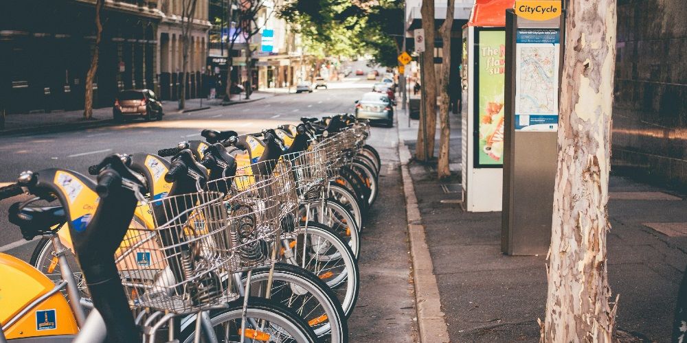 E-bikes stacked by a road