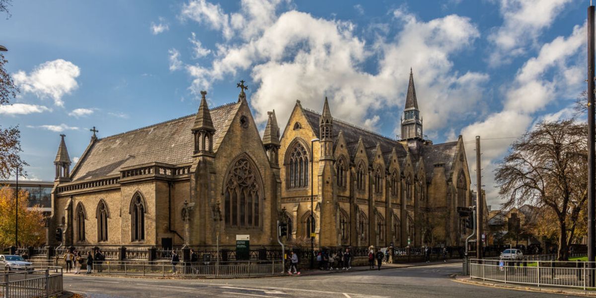 The University of Leeds Business School, a large gothic building.