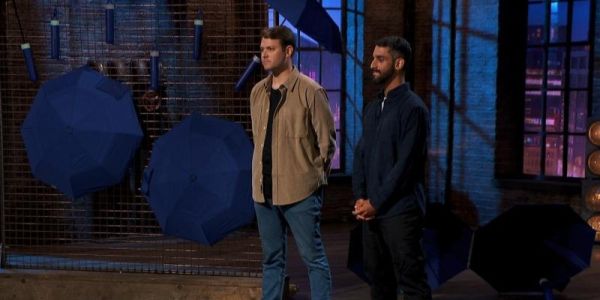 Reid Jacoby stands next to Trib Gosain as they pitch their high performance umbrellas to the investor dragons on the BBC series Dragons' Den.