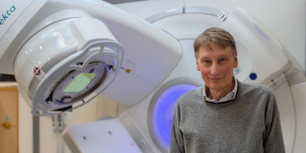 Professor Adrian Crellin with a state-of-the art linear accelerator (LINAC) radiotherapy machine at Leeds Teaching Hospitals NHS Trust.