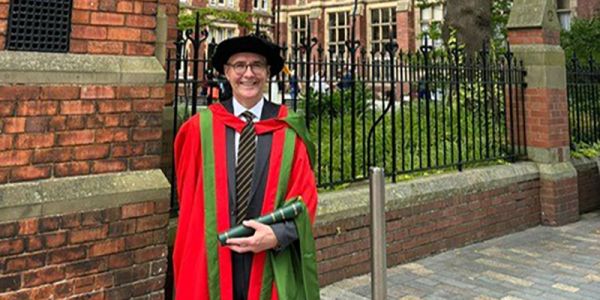 Gordon Cook in graduation gowns