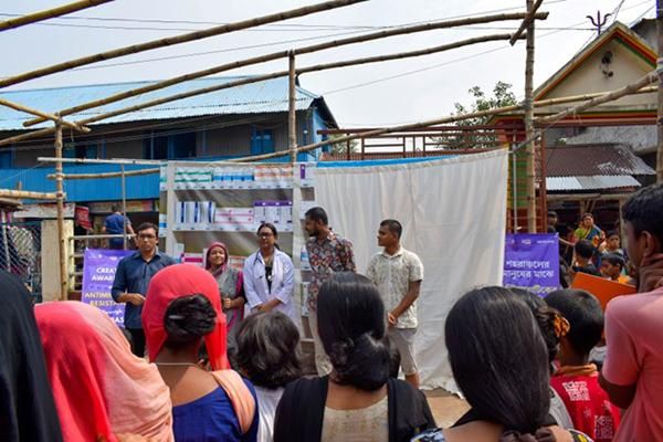 performing artists share their street theatre production, focussing on AMR, with a community in Dhaka