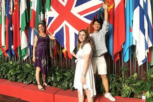Mature student Sarah Lloyd holidng a UK flag with two others in China