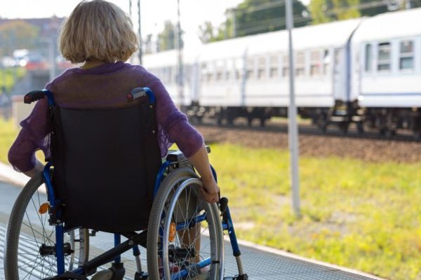 Person in wheelchair on train platform