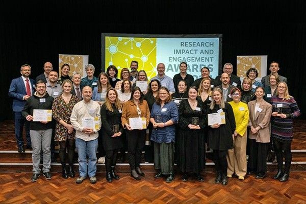 A team photo at an awards ceremony.