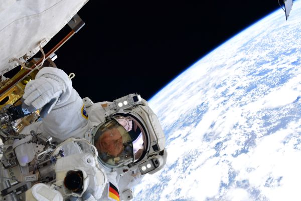 Man floats in space in a spacesuit