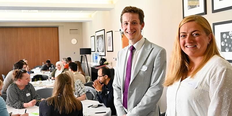 Dr Oliver Todd and Dr Rebecca Birch stand at the head of an event exploring data science in ageing research