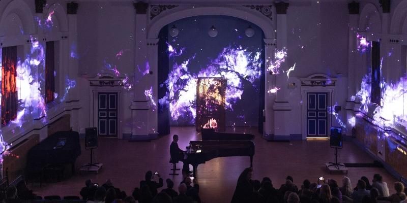 Pianist Ben Finlay performs on stage at Smeaton's Planetarium.