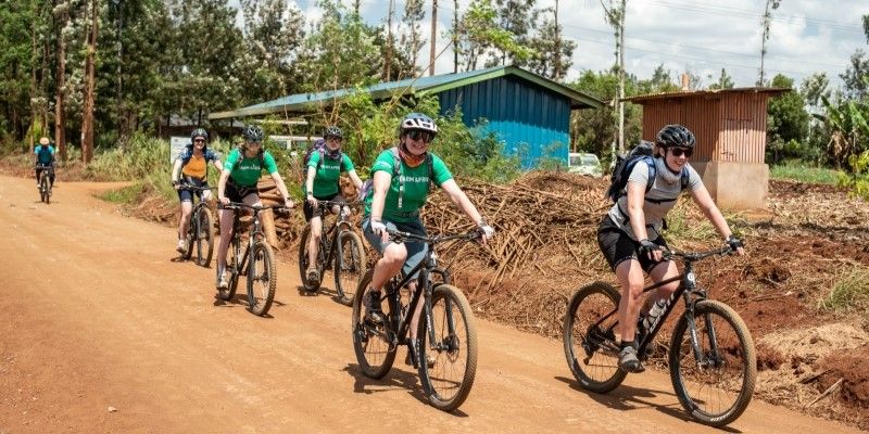 Professor Michelle Morris cycling across Kenya with the Farm Africa team.