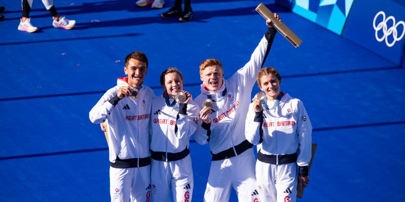 Sam Dickinson celebrates Olympic bronze with his teammates