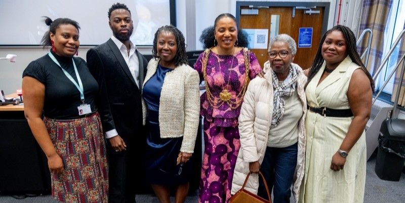 Professor Lisa-Dionne Morris with friends & family and the Lord Mayor stood in a group smiling at the camera.