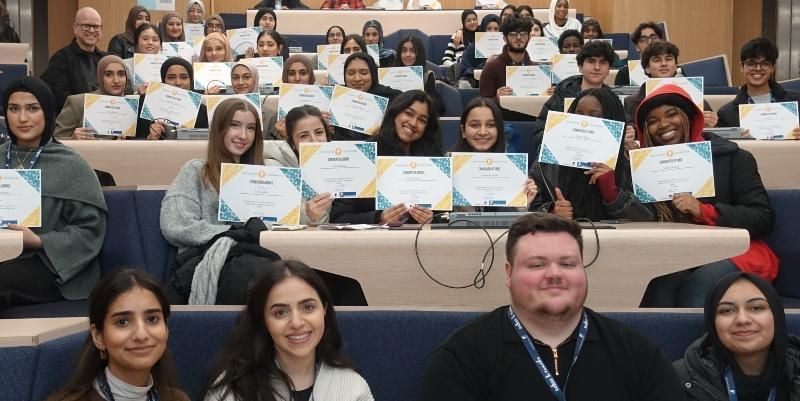 Students who completed the RAISED in Yorkshire programme hold up their certificates.