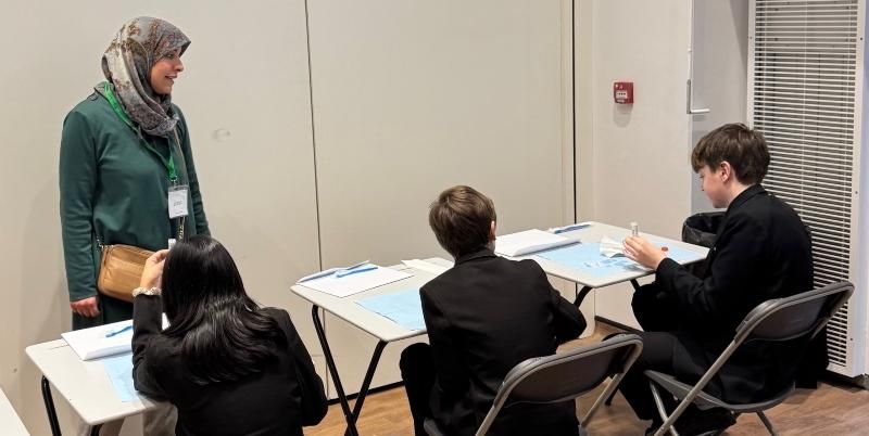 PhD student Yasmen Elsadek is seen teaching pupils about what causes tooth decay and the best ways of combatting it.